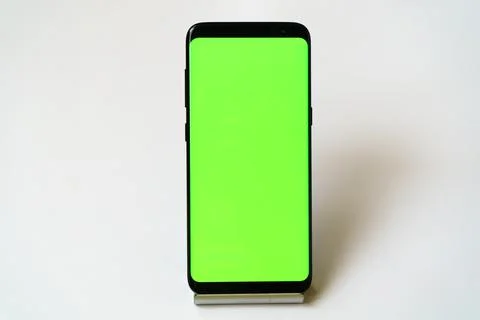 Smartphone stands on a stand with a blank screen Stock Photos