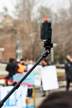 Smartphone on a stick for taking selfies Stock Photos
