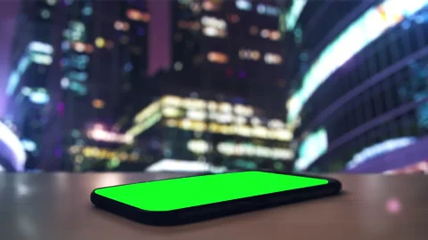Smartphone on table with blurred city lights Stock Footage 302397164