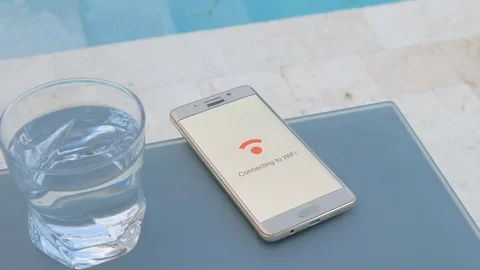 Smartphone on a table connects to WiFi Stock Footage 95040274