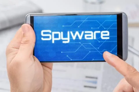 Smartphone with the text Spyware on the display Стоковые фото