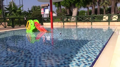 Smartphone is thrown into the pool water Stock Footage 78589427