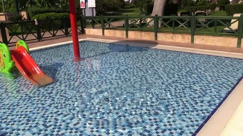 Smartphone is thrown into the pool water. Slow Motion. Stock Footage 78589499