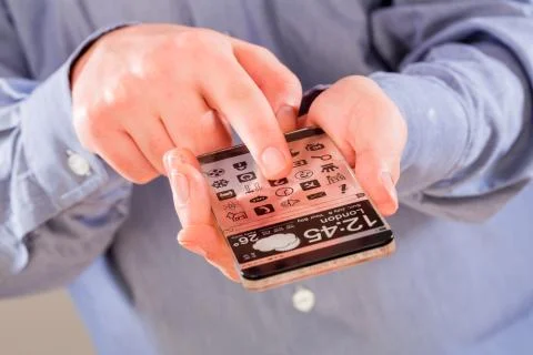 Smartphone with transparent screen in human hands. 写真素材