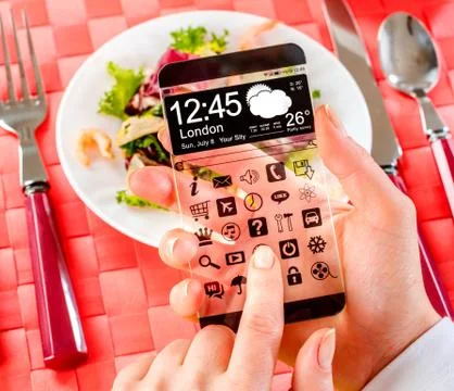 Smartphone with transparent screen in human hands. Foto stock