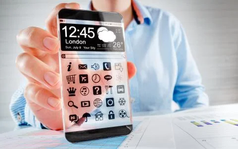Smartphone with transparent screen in human hands. Stock Photos
