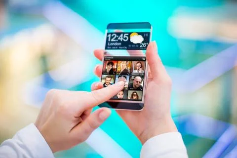 Smartphone with transparent screen in human hands. 写真素材