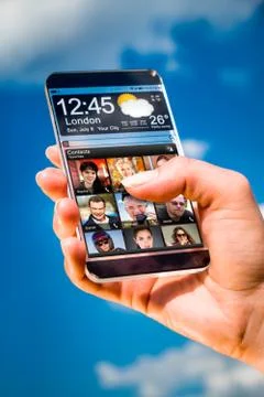 Smartphone with transparent screen in human hands. Foto stock