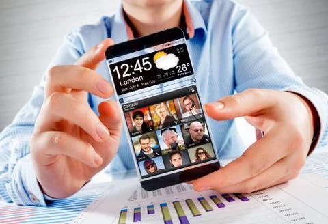 Smartphone with transparent screen in human hands. Foto stock
