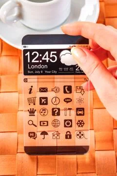 Smartphone with transparent screen in human hands. Foto stock