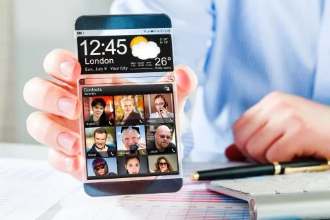 Smartphone with transparent screen in human hands. Foto stock