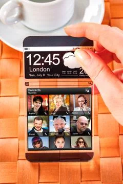 Smartphone with transparent screen in human hands. Foto stock