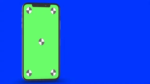 Smartphone turns on on blue background. Easy customizable green screen. Computer Stock Footage 125239484