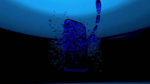 Smartphone turns on on cyan background. Stock Footage 43538350