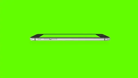 Smartphone turns on on Green background. Easy customizable green screen. Stock Footage 70545418
