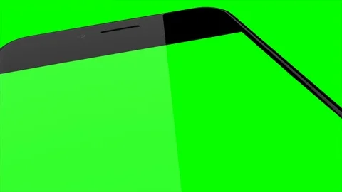 Smartphone turns on on Green background. Easy customizable green screen Stock Footage 70555087