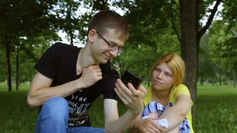 The smartphone types the text by voice input and shows the results to the guy. T Stock Footage 101614507