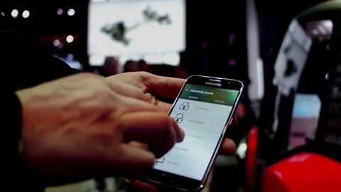 Smartphone used to close hatch on SUV at Detroit International Auto Show Stock-Footage 72329723