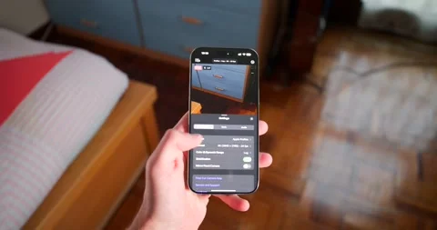 Smartphone users changes video recording settings for iPhone photography Video stock 303806833