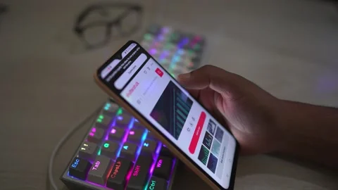 Smartphone using a person play video by hand Stock Footage 290948900