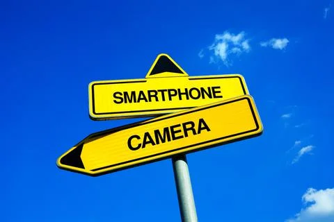 Smartphone vs Camera - decision and comparison between electronics and techno Stock Photos