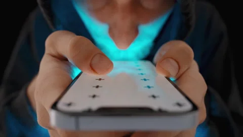 Smartphone with a White Screen Layout and Tracking Markers. A Man in a Hoodie, I Stock Footage 256954564