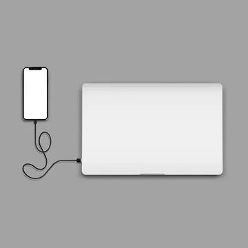 Smartphone with wireless charger connected to closed laptop Stock Illustration