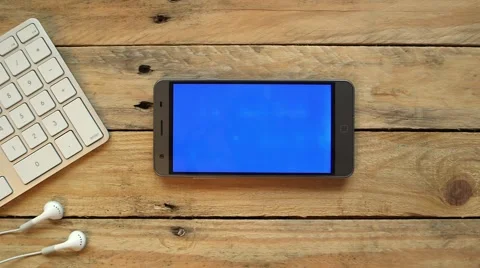 Smartphone on wooden table Stock Footage 63432436