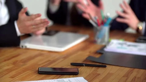 The smartphone is on a wooden table Stock Footage 85058368