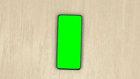 Smartphone on wooden table Video stock 134801843