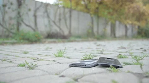 Smartphones cellphone phone drop to the ground.broken and damaged Stock Footage 143479853