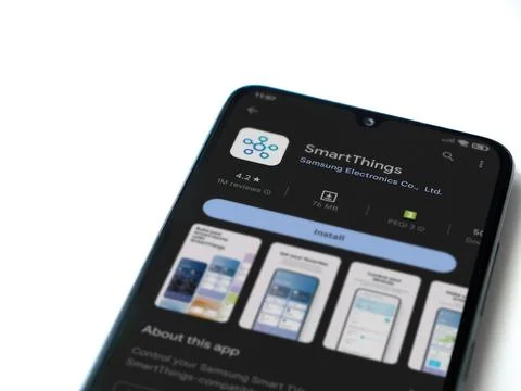 Smartthings app play store page on smartphone on white background Stock Photos