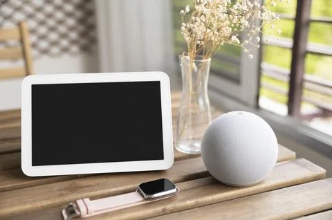 Smartwatch and tablet Devices assortment on table Stock Photos