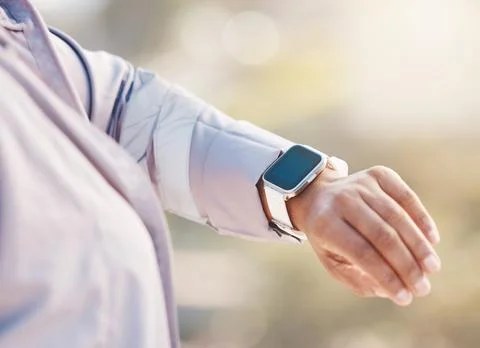 Smartwatch check, woman and hand with exercise, time or heart monitor with Stock Photos