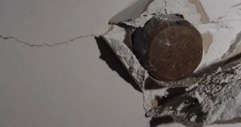 Smash through Drywall with hammer in slow motion Stock Footage 62765597