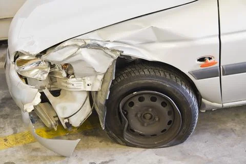Smashed Car; Car With Smashed Front Fender And A Flat Tire 스톡 사진