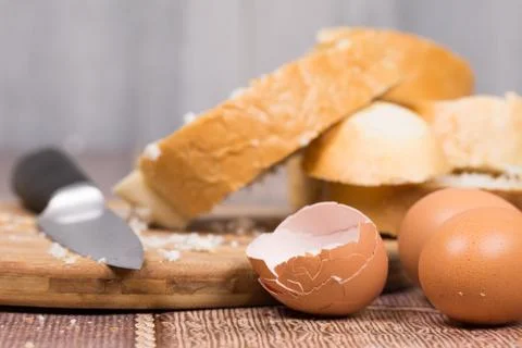 Smashed eggs and bread for french toast Stock Photos