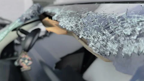 Smashed front windshield glass at accident scene 4k Stock Footage 332955619