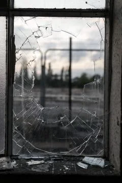 Smashed Glass Window Frame with Blurred Background Stock Photos