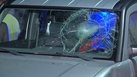 Smashed windshield from car crash at night Stock Footage 133168274
