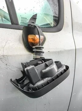 Smashed wing mirror Vandalised car with smashed wing mirror. Insurance. Bu... Stock Photos