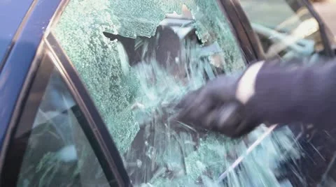 Smashing car window - stealing - HD Stock Footage