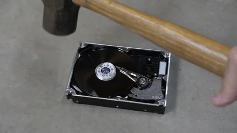 Smashing a computer hard drive disk to avoid data theft Stock Footage 221863822