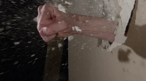 Smashing through Drywall in slow motion - fist coming through the wall Stock Footage 62765239