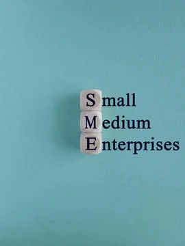 SME concept, Small Medium Enterprise concept on wooden cubes. Foto stock