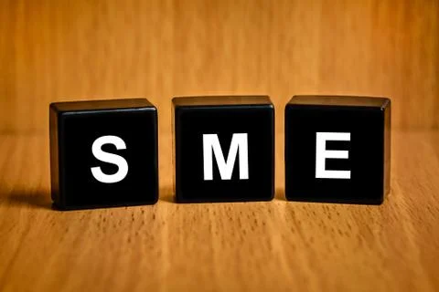 Sme or small and medium enterprises word on black block Foto stock