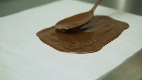 Smear chocolate on paper. Stock Footage 93063049