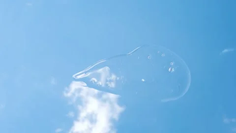 Smear of clear shower gel or shampoo against sky and clouds background, top view Stock Footage 315733952
