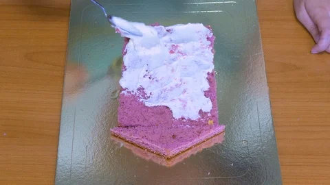 To smear colored cake sponge cake cream Stock Footage 123577119
