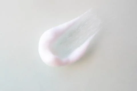 Smear of foam bubbles on a light background Stock Photos